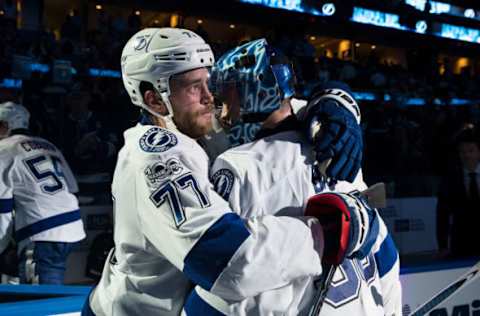 TAMPA, FL – FEBRUARY 7: Ben Bishop being embraced by Victor Hedman.