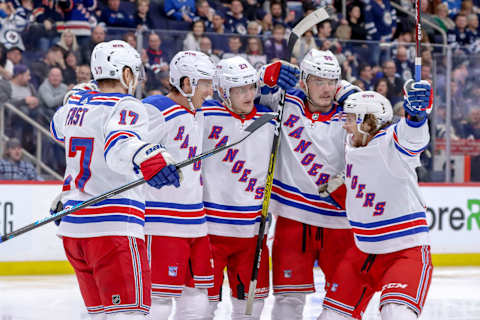 WINNIPEG, MB – FEBRUARY 11: Jesper Fast #17, Ryan Strome #16, Adam Fox #23, Ryan Lindgren #55 and Artemi Panarin #10 of the New York Rangers celebrate a third period goal against the Winnipeg Jets at the Bell MTS Place on February 11, 2020 in Winnipeg, Manitoba, Canada. (Photo by Darcy Finley/NHLI via Getty Images)