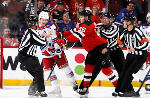 NEWARK, NEW JERSEY – APRIL 20: Timo Meier #96 of the New Jersey Devils gets the stick on h23 during the third period during Game Two in the First Round of the 2023 Stanley Cup Playoffs at the Prudential Center on April 20, 2023 in Newark, New Jersey. The Rangers defeated the Devils 5-1. (Photo by Bruce Bennett/Getty Images)