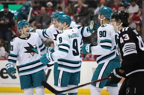 Dec 1, 2023; Newark, New Jersey, USA; San Jose Sharks defenseman Jacob MacDonald (9) celebrates his goal with teammates during the second period against the New Jersey Devils at Prudential Center. Mandatory Credit: Vincent Carchietta-USA TODAY Sports