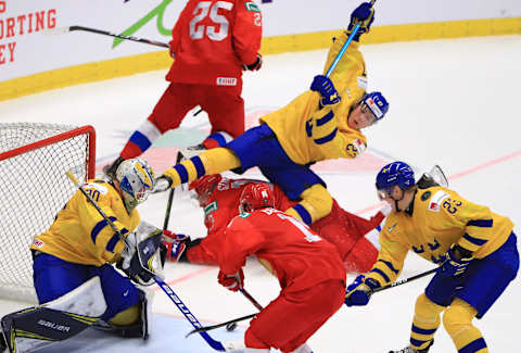 OSTRAVA, CZECH REPUBLIC – JANUARY 4, 2020: Sweden’s goalie Hugo Alnefelt, Russia’s Yegor Sokolov and Sweden’s Nils Lundkvist (L-R) in their 2020 World Junior Ice Hockey Championship semifinal match at Ostravar Arena. Peter Kovalev/TASS (Photo by Peter KovalevTASS via Getty Images)