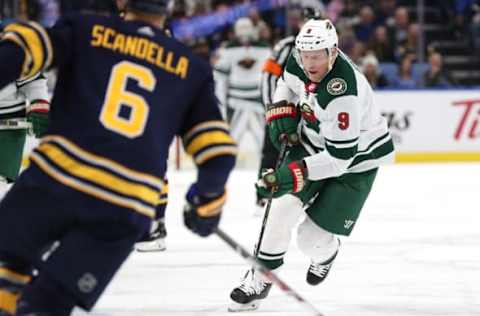 BUFFALO, NY – NOVEMBER 22: Mikko Koivu #9 of the Minnesota Wild skates up ice with the puck as Marco Scandella #6 of the Buffalo Sabres defends during the first period at the KeyBank Center on November 22, 2017 in Buffalo, New York. (Photo by Kevin Hoffman/Getty Images)