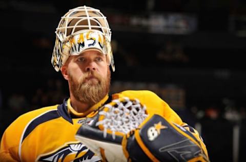 NASHVILLE, TN – FEBRUARY 25: Goalie Chris Mason #30 of the Nashville Predators warms up prior to a game against the Dallas Stars at the Bridgestone Arena on February 25, 2013 in Nashville, Tennessee. (Photo by Frederick Breedon/Getty Images)