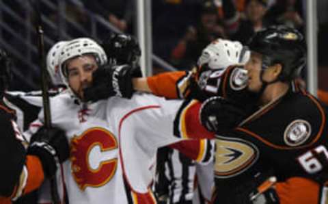 Apr 4, 2017; Anaheim, CA, USA; Calgary Flames defenseman Deryk Engelland (29) and Anaheim Ducks center Rickard Rakell (67) fight in the third period during a NHL hockey game at Honda Center.The Ducks defeated the Flames 3-1. Mandatory Credit: Kirby Lee-USA TODAY Sports