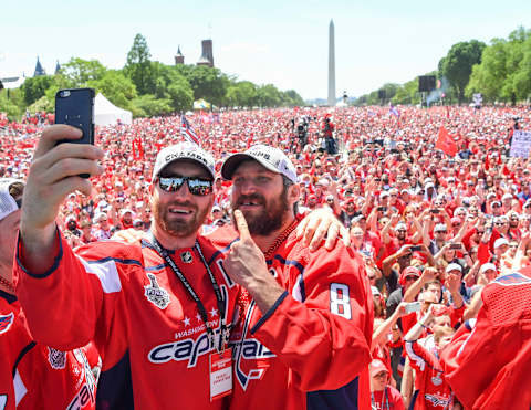 WASHINGTON, DC – JUNE 12: Washington Capitals defenseman Brooks Orpik (44) takes a selfie with Alex Ovechkin (8) and thousands of fans during the Parade for the Stanley Cup Champion Washington Capitals. (Photo by Jonathan Newton/The Washington Post via Getty Images)