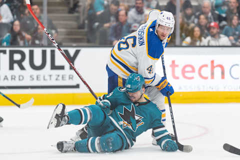 Feb 18, 2023; San Jose, California, USA; San Jose Sharks center Tomas Hertl (48) falls in front of Buffalo Sabres defenseman Ilya Lyubushkin (46) during the third period at SAP Center at San Jose. Mandatory Credit: Stan Szeto-USA TODAY Sports