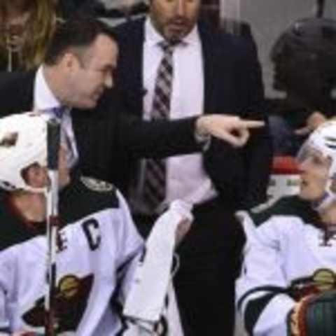 Feb 15, 2016; Vancouver, British Columbia, CAN; Minnesota Wild head coach John Torchetti talks with players on the bench during the third period against the Vancouver Canucks at Rogers Arena. The Minnesota Wild won 5-2. Anne-Marie Sorvin-USA TODAY Sports