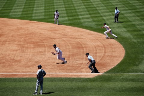 DENVER, CO – AUGUST 05: The Colorado Rockies infield employ the infield shift as they defend against the Seattle Mariners during interleague play at Coors Field on August 5, 2015 in Denver, Colorado. The Rockies defeated the Mariners 7-5 in 11 innings. (Photo by Doug Pensinger/Getty Images)