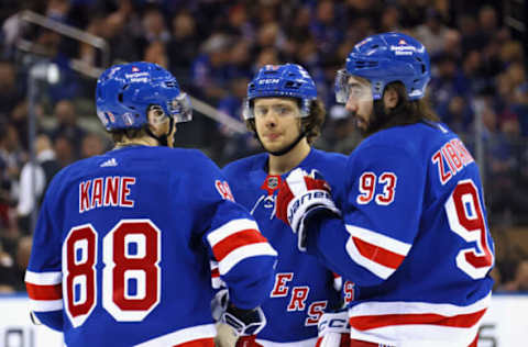 NEW YORK, NEW YORK – APRIL 24: (L-R) Patrick Kane #88, Artemi Panarin #10, and Mika Zibanejad #93 of the New York Rangers confer before a second-period faceoff against the New Jersey Devils in Game Four of the First Round of the 2023 Stanley Cup Playoffs at Madison Square Garden on April 24, 2023 in New York, New York. (Photo by Bruce Bennett/Getty Images)