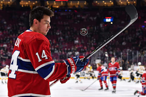 MONTREAL, QC – APRIL 24: Nick Suzuki #14 of the Montreal Canadiens juggles the puck during warmups prior to the game against the Boston Bruins at Centre Bell on April 24, 2022 in Montreal, Canada. The Boston Bruins defeated the Montreal Canadiens 5-3. (Photo by Minas Panagiotakis/Getty Images)