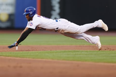 NEW YORK, NEW YORK – AUGUST 13: Starling Marte #6 of the New York Mets slides into second during the first inning against the Philadelphia Phillies at Citi Field on August 13, 2022 in the Queens borough of New York City. (Photo by Sarah Stier/Getty Images)