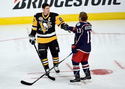 Jan 28, 2017; Los Angeles, CA, USA; Pittsburgh Penguins forward Sidney Crosby (87) reacts with Columbus Blue Jackets forward Cam Atkinson (13) after winning the accuracy shooting event in the 2017 NHL All Star Game skills competition at Staples Center. Mandatory Credit: Gary A. Vasquez-USA TODAY Sports