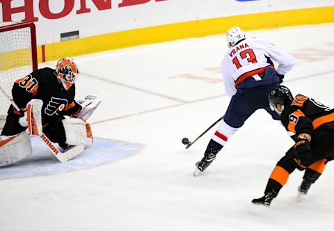 WASHINGTON, DC – MARCH 24: Washington Capitals left wing Jakub Vrana (13) fires a shot on goal in the third period against Philadelphia Flyers goaltender Brian Elliott (37) on March 24, 2019, at the Capital One Arena in Washington, D.C. (Photo by Mark Goldman/Icon Sportswire via Getty Images)