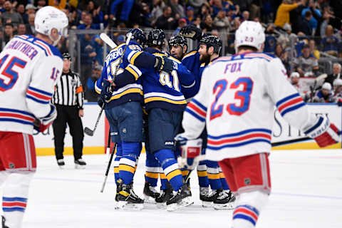 Mar 10, 2022; St. Louis, Missouri, USA; St. Louis Blues defenseman Jake Walman (46) is congratulated by teammates after scoring a goal against the New York Rangers during the second period at Enterprise Center. Mandatory Credit: Jeff Le-USA TODAY Sports