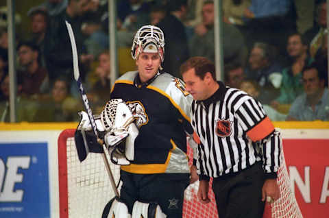 TORONTO, ON – OCTOBER 19: Referee Paul Devorski has a chat with Mike Dunham #1 of the Nashville Predators against the Toronto Maple Leafs during NHL game action on October 19, 1998 at Maple Leaf Gardens in Toronto, Ontario, Canada. (Photo by Graig Abel/Getty Images)