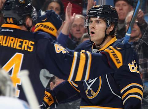 BUFFALO, NY – DECEMBER 11: Marcus Foligno #82 of the Buffalo Sabres celebrates his second-period goal against the Calgary Flames with teammate Nicolas Deslauriers #44 at First Niagara Center on December 11, 2014 in Buffalo, New York. (Photo by Jen Fuller/Getty Images)