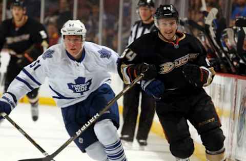 ANAHEIM, CA – NOVEMBER 27: Brandon McMillan #64 of the Anaheim Ducks races for the puck against Jake Gardiner #51 of the Toronto Maple Leafs during the game on November 27, 2011. (Photo by Debora Robinson/NHLI via Getty Images)