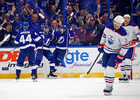 TAMPA, FLORIDA – NOVEMBER 18: Luke Glendening #11 of the Tampa Bay Lightning (C) celebrates his third period goal against the Edmonton Oilers at Amalie Arena on November 18, 2023 in Tampa, Florida. The Lightning defeated the Oilers 6-4. (Photo by Bruce Bennett/Getty Images)