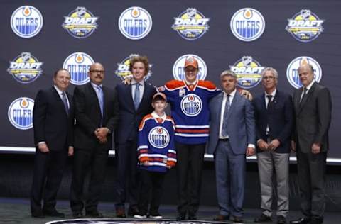 Jun 24, 2016; Buffalo, NY, USA; Jesse Puljujarvi poses for a photo after being selected as the number four overall draft pick by the Edmonton Oilers in the first round of the 2016 NHL Draft at the First Niagra Center. Mandatory Credit: Timothy T. Ludwig-USA TODAY Sports