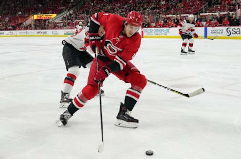 RALEIGH, NC – NOVEMBER 18: Carolina Hurricanes Defenceman Haydn Fleury (4) skates after a loose puck during a game between the Carolina Hurricanes and the New Jersey Devils at the PNC Arena in Raleigh, NC on November 18, 2018. (Photo by Greg Thompson/Icon Sportswire via Getty Images)