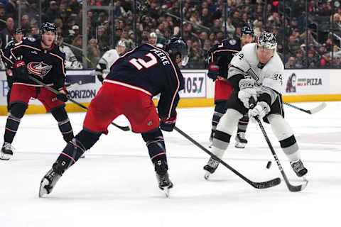 COLUMBUS, OHIO – DECEMBER 05: Arthur Kaliyev #34 of the Los Angeles Kings shoots the puck against Andrew Peeke #2 of the Columbus Blue Jackets during the third period at Nationwide Arena on December 05, 2023 in Columbus, Ohio. (Photo by Jason Mowry/Getty Images)