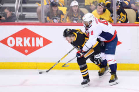 PITTSBURGH, PA – MAY 07: Pittsburgh Penguins center Evgeni Malkin (71) and Washington Capitals Left Wing Alex Ovechkin (8) battle along the boards for the puck during the second period in Game Six of the Eastern Conference Second Round in the 2018 NHL Stanley Cup Playoffs between the Washington Capitals and the Pittsburgh Penguins on May 7, 2018, at PPG Paints Arena in Pittsburgh, PA. (Photo by Jeanine Leech/Icon Sportswire via Getty Images)