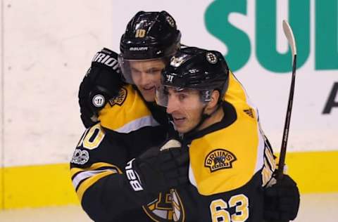 BOSTON – OCTOBER 19: Boston Bruins’ Anders Bjork is congratulated by teammate Brad Marchand after his first goal of the first period. The Boston Bruins host the Vancouver Canucks in a regular season NHL hockey game at TD Garden in Boston on Oct. 19, 2017. (Photo by John Tlumacki/The Boston Globe via Getty Images)