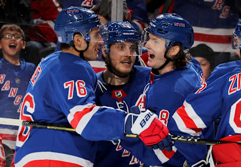 Brady Skjei #76,Jesper Fast #17 and Jacob Trouba #8 of the New York Rangers