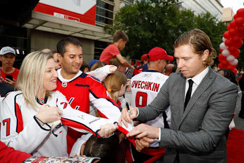 WASHINGTON, DC – OCTOBER 05: Nicklas Backstrom #19 of the Washington Capitals signs autographs for fans on Rock The Red Carpet before the home opener against the Carolina Hurricanes at Capital One Arena on October 5, 2019 in Washington, DC. (Photo by Patrick McDermott/NHLI via Getty Images)