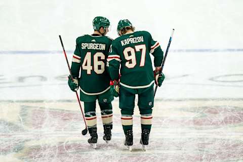 Jan 24, 2021; Saint Paul, Minnesota, USA; Minnesota Wild defenseman Jared Spurgeon (46) talks with forward Kirill Kaprizov (97) during the third period against the San Jose Sharkse at Xcel Energy Center. Mandatory Credit: Brace Hemmelgarn-USA TODAY Sports