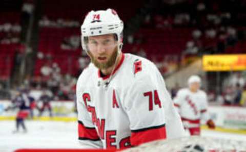 RALEIGH, NC – OCTOBER 12: Jaccob Slavin #74 of the Carolina Hurricanes lifts the puck into the top of the net during warmups prior to an NHL game against the Columbus Blue Jackets on October 12, 2019 at PNC Arena in Raleigh North Carolina. (Photo by Gregg Forwerck/NHLI via Getty Images)