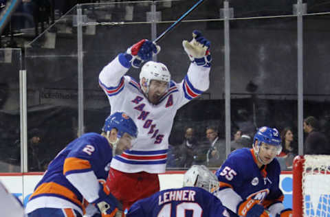 NEW YORK, NEW YORK – JANUARY 12: Chris Kreider #20 of the New York Rangers celebrates the game winning goal by Mats Zuccarello #36 (not shown) at 14:55 of the third period against the New York Islanders at the Barclays Center on January 12, 2019 in the Brooklyn borough of New York City. The Rangers defeated the Islanders 3-2. (Photo by Bruce Bennett/Getty Images)