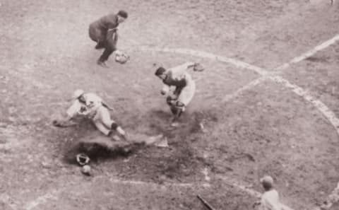 Pepper Martin scores against A’s catcher Mickey Cochrane during the 1931 World Series. (Photo by Mark Rucker/Transcendental Graphics, Getty Images)