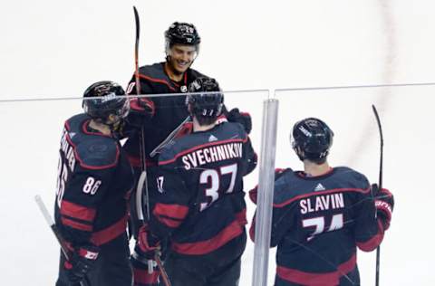 TORONTO, ONTARIO – AUGUST 03: Andrei Svechnikov #37 of the Carolina Hurricanes celebrates with Jaccob Slavin #74, Teuvo Teravainen #86 and Sebastian Aho #20 after scoring a goal against the New York Rangers in the third period of Game Two of the Eastern Conference Qualification Round prior to the 2020 NHL Stanley Cup Playoffs at Scotiabank Arena on August 3, 2020, in Toronto, Ontario, Canada. (Photo by Andre Ringuette/Freestyle Photo/Getty Images)