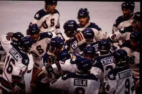 22 Feb 1980: The USA Team celebrates their 4-3 victory over Russia in the semi-final of the Ice Hockey event at the 1980 Winter Olympic Games in Lake Placid, USA. The game was dubbed “The Miracle on Ice”. The USA went on to win the gold medal by defeat