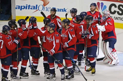 NHL Power Rankings: Washington Capitals players celebrates with Capitals goalie Philipp Grubauer (31) after their game against the Colorado Avalanche at Verizon Center. The Capitals won 3-0. Mandatory Credit: Geoff Burke-USA TODAY Sports