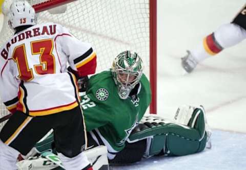 Dec 6, 2016; Dallas, TX, USA; Calgary Flames left wing Johnny Gaudreau (13) scores a goal against Dallas Stars goalie Kari Lehtonen (32) during the second period at the American Airlines Center. Mandatory Credit: Jerome Miron-USA TODAY Sports