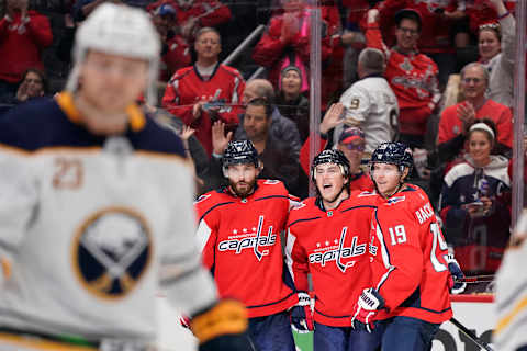 WASHINGTON, DC – NOVEMBER 01: T.J. Oshie #77 of the Washington Capitals celebrates with Michal Kempny #6 and Nicklas Backstrom #19 after scoring a goal in the third period against the Buffalo Sabres at Capital One Arena on November 1, 2019 in Washington, DC. (Photo by Patrick McDermott/NHLI via Getty Images)