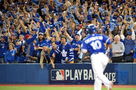 Oct 9, 2016; Toronto, Ontario, CAN; Toronto Blue Jays fans cheer after a two-run home run by designated hitter Edwin Encarnacion (10) in the first inning against the Texas Rangers during game three of the 2016 ALDS playoff baseball series at Rogers Centre. Mandatory Credit: Dan Hamilton-USA TODAY Sports