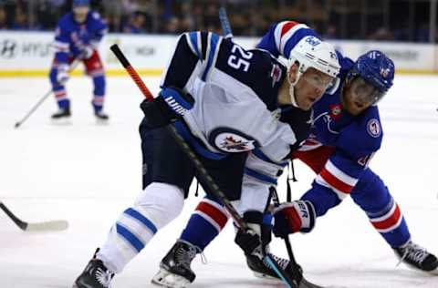 NEW YORK, NEW YORK – APRIL 19: Paul Stastny #25 of the Winnipeg Jets and Andrew Copp #18 of the New York Rangers face off during the second period at Madison Square Garden on April 19, 2022, in New York City. (Photo by Elsa/Getty Images)