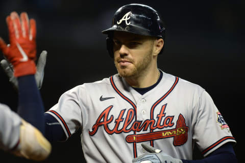 Sep 22, 2021; Phoenix, Arizona, USA; Atlanta Braves first baseman Freddie Freeman (5) celebrates after hitting a home run against the Arizona Diamondbacks during the ninth inning at Chase Field. Mandatory Credit: Joe Camporeale-USA TODAY Sports