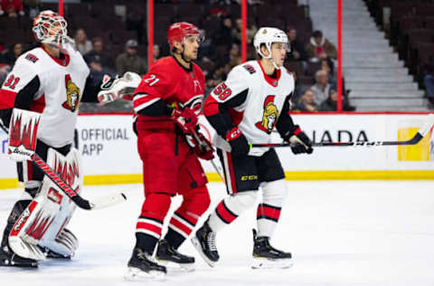 OTTAWA, ON – FEBRUARY 12: Carolina Hurricanes Left Wing Nino Niederreiter (21) sets up between Ottawa Senators Goalie Anders Nilsson (31) and Ottawa Senators Defenceman Maxime Lajoie (58) during third period National Hockey League action between the Carolina Hurricanes and Ottawa Senators on February 12, 2019, at Canadian Tire Centre in Ottawa, ON, Canada. (Photo by Richard A. Whittaker/Icon Sportswire via Getty Images)