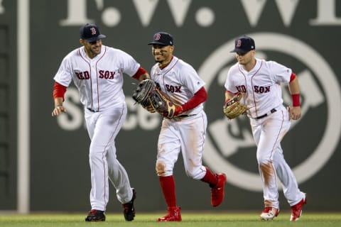 BOSTON, MA – MAY 16: J.D. Martinez #28, Mookie Betts #50, and Andrew Benintendi #16 of the Boston Red Sox celebrate a victory against the Oakland Athletics on May 16, 2018 at Fenway Park in Boston, Massachusetts. (Photo by Billie Weiss/Boston Red Sox/Getty Images)