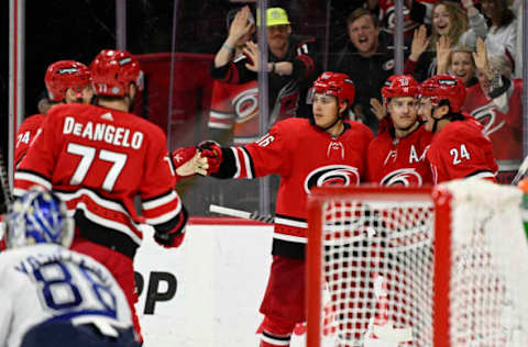 RALEIGH, NORTH CAROLINA – MARCH 22: The Carolina Hurricanes celebrate a goal by Sebastian Aho #20 during the third period against the Tampa Bay Lightning at PNC Arena on March 22, 2022, in Raleigh, North Carolina. (Photo by Eakin Howard/Getty Images)