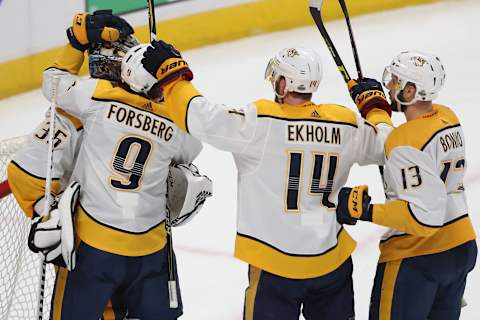 DENVER, CO – APRIL 18: Goalie Pekka Rinne #35 of the Nashville Predators is congratulated by teammates Filip Forsberg #9, Mattias Elkholm #14 and Nick Bonino #13 after a 3-2 win against the Colorado Avalanche in Game Four of the Western Conference First Round during the 2018 NHL Stanley Cup Playoffs at the Pepsi Center on April 18, 2018 in Denver, Colorado. (Photo by Matthew Stockman/Getty Images)