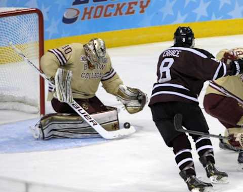 Apr 10, 2014; Philadelphia, PA, USA; Boston College Eagles goalie Thatcher Demko (30) makes a save against Union Dutchmen forward Nick Cruice (8) during the first period in the semifinals of the Frozen Four college ice hockey tournament at Wells Fargo Center. Mandatory Credit: Eric Hartline-USA TODAY Sports