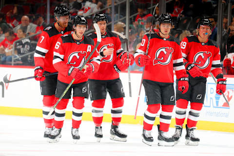 New Jersey Devils Jack Hughes, Erik Haula, and Alexander Holtz. (Photo by Rich Graessle/Getty Images)