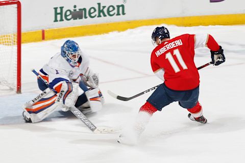 SUNRISE, FL – APRIL 04: Goaltender Thomas Greiss #1 of the New York Islanders stops a shot by Jonathan Huberdeau #11 of the Florida Panthers during the shootout at the BB&T Center on April 4, 2019 in Sunrise, Florida. The Islanders defeated the Panthers 2-1 in a shootout. (Photo by Joel Auerbach/Icon Sportswire via Getty Images)