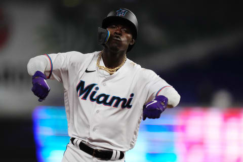 Jun 7, 2022; Miami, Florida, USA; Miami Marlins second baseman Jazz Chisholm Jr. (2) rounds the bases and flexes after connecting for a grand slam home run in the 2nd inning against the Washington Nationals at loanDepot park. Mandatory Credit: Jasen Vinlove-USA TODAY Sports