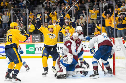 Nov 20, 2023; Nashville, Tennessee, USA; Nashville Predators center Yakov Trenin (13) celebrates the game winning goal against the Colorado Avalanche during the third period at Bridgestone Arena. Mandatory Credit: Steve Roberts-USA TODAY Sports